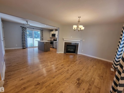 1-4 8514 83 Avenue, Edmonton, AB - Indoor Photo Showing Living Room With Fireplace