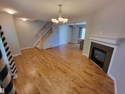 1-4 8514 83 Avenue, Edmonton, AB - Indoor Photo Showing Other Room With Fireplace