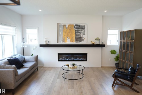 5557 Schonsee Drive, Edmonton, AB - Indoor Photo Showing Living Room With Fireplace