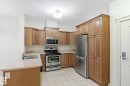 111 9820 165 Street, Edmonton, AB  - Indoor Photo Showing Kitchen With Stainless Steel Kitchen With Double Sink 