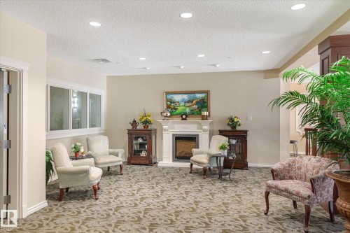 111 9820 165 Street, Edmonton, AB - Indoor With Fireplace