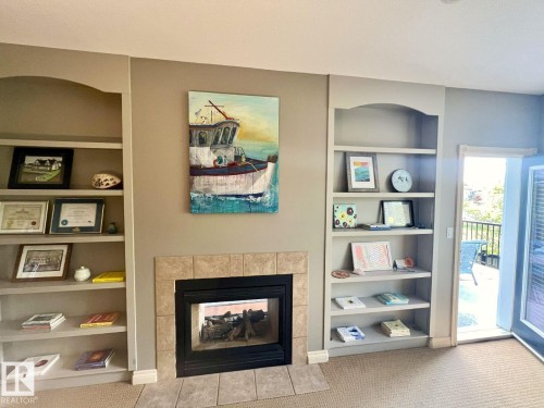 6004 32 Avenue, Beaumont, AB - Indoor Photo Showing Living Room With Fireplace