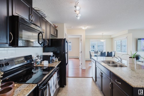 415 12650 142 Avenue, Edmonton, AB - Indoor Photo Showing Kitchen With Double Sink