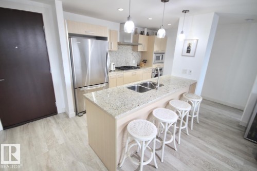 105 2612 109 Street, Edmonton, AB - Indoor Photo Showing Kitchen With Stainless Steel Kitchen With Double Sink With Upgraded Kitchen