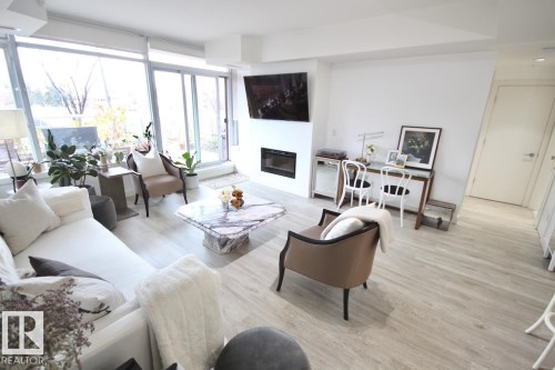 105 2612 109 Street, Edmonton, AB - Indoor Photo Showing Living Room With Fireplace