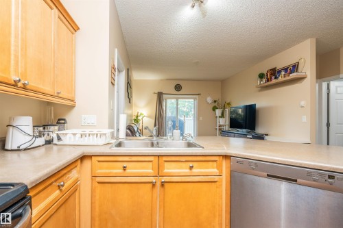 #117 226 Macewan Road Sw, Edmonton, AB - Indoor Photo Showing Kitchen With Double Sink