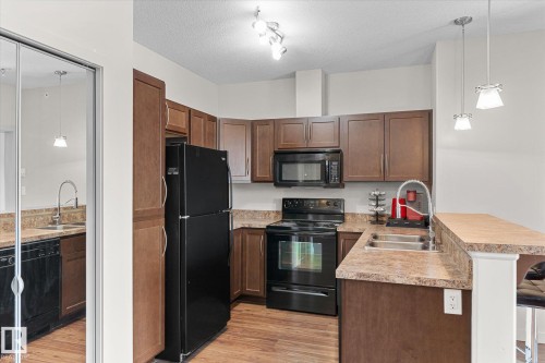 405 304 Ambleside Link, Edmonton, AB - Indoor Photo Showing Kitchen With Double Sink