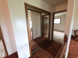 Hall featuring carpet floors - 