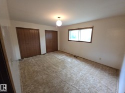 Unfurnished bedroom with two closets and carpet floors - 