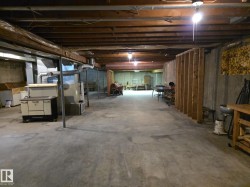 Unfinished below grade area featuring heating unit - 