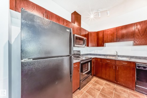102 3010 33 Avenue Nw, Edmonton, AB - Indoor Photo Showing Kitchen With Double Sink