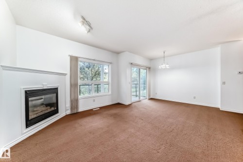 102 3010 33 Avenue Nw, Edmonton, AB - Indoor With Fireplace