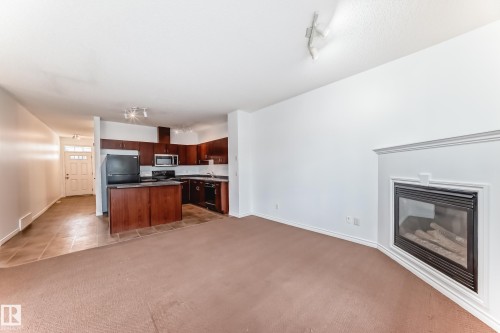 102 3010 33 Avenue Nw, Edmonton, AB - Indoor With Fireplace