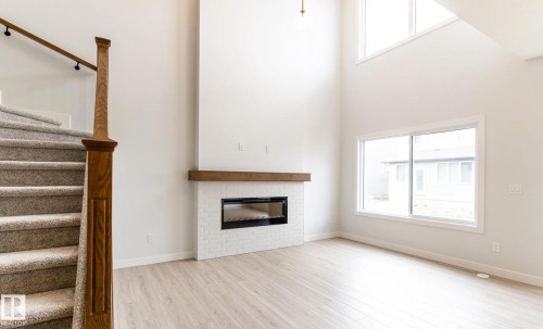 3230 Dixon Way, Edmonton, AB - Indoor Photo Showing Other Room With Fireplace