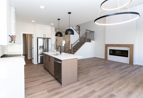 3036 Dixon Landing, Edmonton, AB - Indoor Photo Showing Kitchen With Fireplace With Double Sink With Upgraded Kitchen