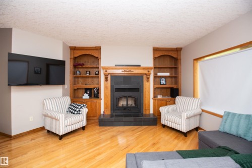 #2-26412 Twp Rd 594, Rural Westlock County, AB - Indoor Photo Showing Living Room With Fireplace
