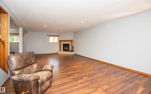 #2-26412 Twp Rd 594, Rural Westlock County, AB - Indoor Photo Showing Other Room With Fireplace