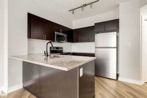 2303 10152 104 Street, Edmonton, AB - Indoor Photo Showing Kitchen With Stainless Steel Kitchen With Double Sink