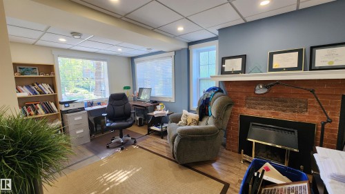 8612 104 Street, Edmonton, AB - Indoor Photo Showing Other Room With Fireplace