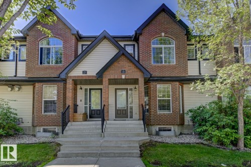 View of front facade featuring brick siding - 18 5281 Terwillegar Boulevard, Edmonton, AB - Outdoor With Facade