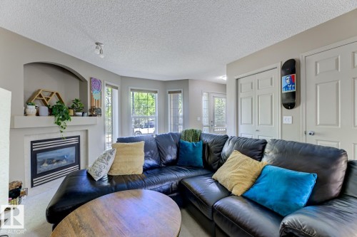 18 5281 Terwillegar Boulevard, Edmonton, AB - Indoor Photo Showing Living Room With Fireplace