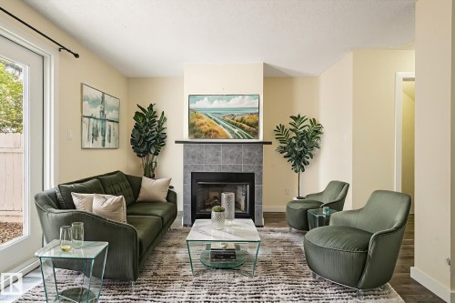 105 14707 53 Avenue, Edmonton, AB - Indoor Photo Showing Living Room With Fireplace