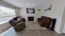 3311 21 Street, Edmonton, AB  - Indoor Photo Showing Living Room With Fireplace 