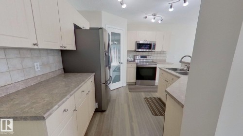 3311 21 Street, Edmonton, AB - Indoor Photo Showing Kitchen With Double Sink