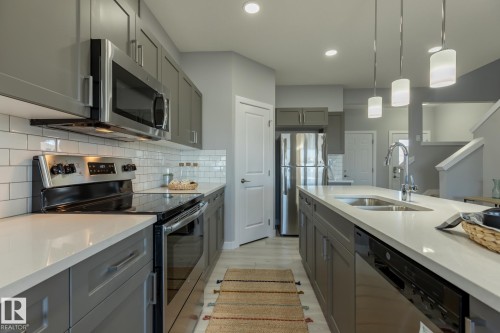 10716 99 Street, Morinville, AB - Indoor Photo Showing Kitchen With Double Sink With Upgraded Kitchen