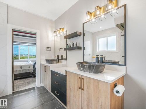 Ensuite bathroom featuring vanity and tile patterned floors - 15 Elwyck Gate, Spruce Grove, AB - Indoor