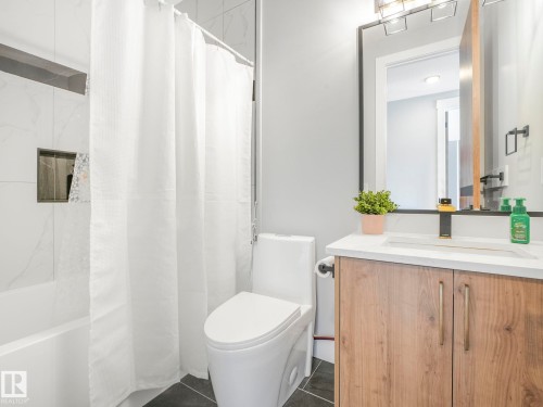 Bathroom with vanity, shower / bath combination with curtain, and tile patterned floors - 15 Elwyck Gate, Spruce Grove, AB - Indoor Photo Showing Bathroom