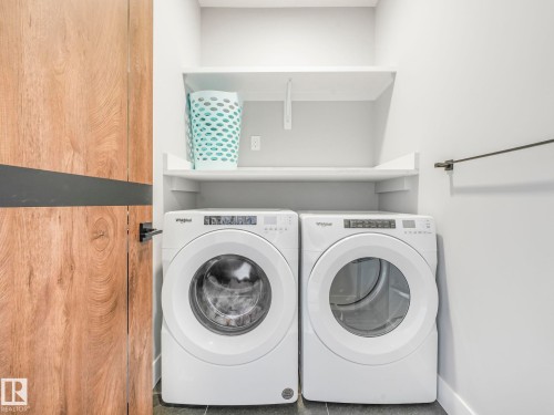 Washroom featuring separate washer and dryer and tile patterned floors - 15 Elwyck Gate, Spruce Grove, AB - Indoor Photo Showing Laundry Room