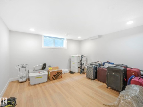 room with wood finished floors and recessed lighting - 15 Elwyck Gate, Spruce Grove, AB - Indoor Photo Showing Other Room