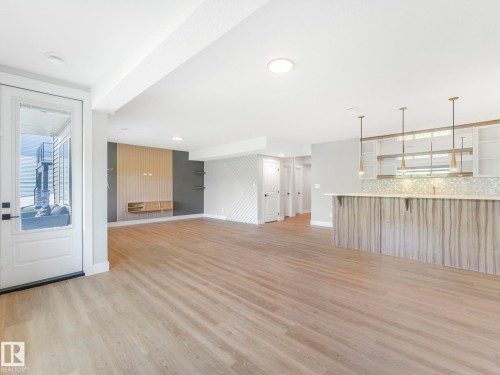 Unfurnished living room with light wood finished floors and baseboards - 15 Elwyck Gate, Spruce Grove, AB - Indoor