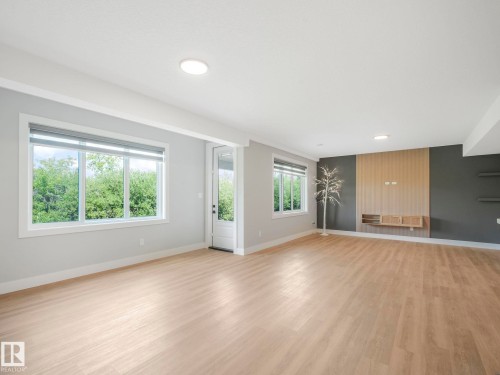 Unfurnished living room featuring light wood-style flooring - 15 Elwyck Gate, Spruce Grove, AB - Indoor