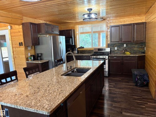 Kitchen featuring an eat up  island - B58018 Hiway 29, Rural St. Paul County, AB - Indoor Photo Showing Kitchen With Double Sink With Upgraded Kitchen