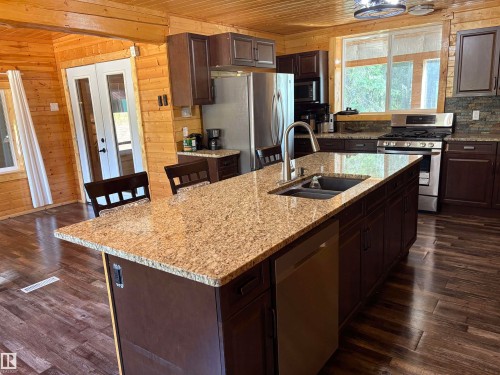 Kitchen  island with dishwasher and eat up counter. - B58018 Hiway 29, Rural St. Paul County, AB - Indoor Photo Showing Kitchen With Double Sink