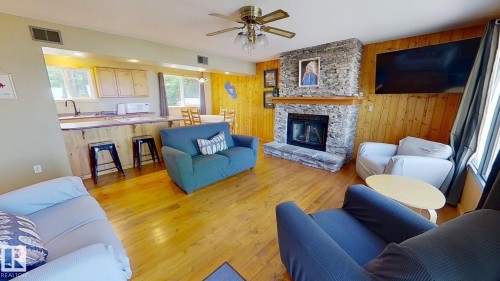 8 Lake Avenue, Rural Wetaskiwin County, AB - Indoor Photo Showing Living Room With Fireplace