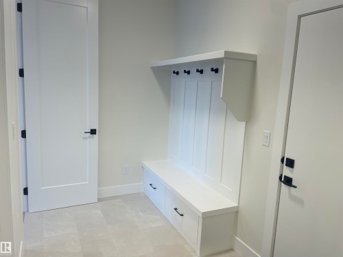 Mudroom with baseboards - 4112 Ginsburg Place, Edmonton, AB - Indoor Photo Showing Other Room