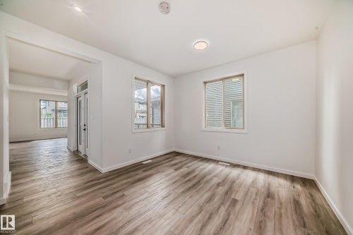 Unfurnished room featuring wood finished floors - 1401 Ainslie Wynd, Edmonton, AB - Indoor Photo Showing Other Room