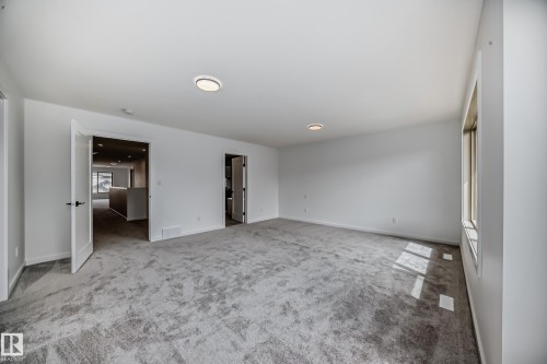 Unfurnished bedroom with carpet and baseboards - 1401 Ainslie Wynd, Edmonton, AB - Indoor Photo Showing Other Room