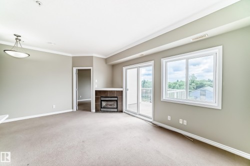 423 8528 82 Avenue, Edmonton, AB - Indoor With Fireplace