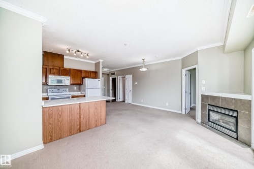 423 8528 82 Avenue, Edmonton, AB - Indoor Photo Showing Kitchen With Fireplace