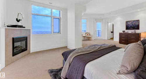 1900 10035 Saskatchewan Drive, Edmonton, AB - Indoor Photo Showing Bedroom With Fireplace
