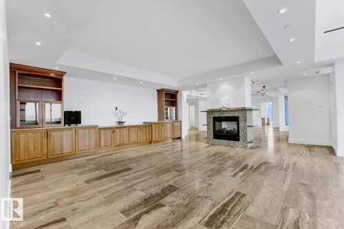 1900 10035 Saskatchewan Drive, Edmonton, AB - Indoor Photo Showing Living Room With Fireplace