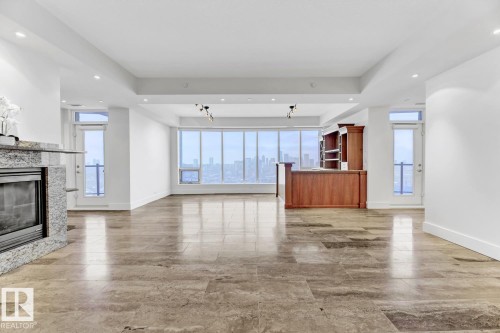 1900 10035 Saskatchewan Drive, Edmonton, AB - Indoor Photo Showing Living Room With Fireplace