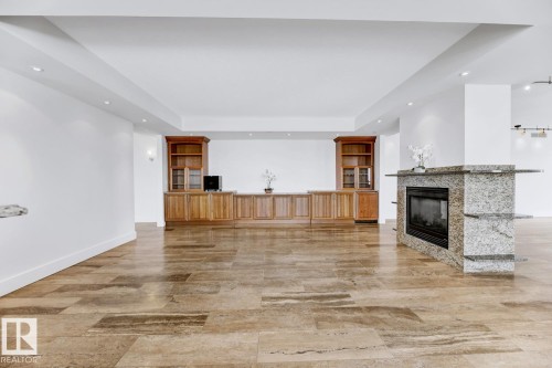 1900 10035 Saskatchewan Drive, Edmonton, AB - Indoor Photo Showing Other Room With Fireplace