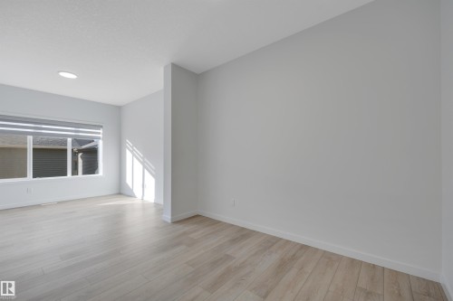 Empty room with light wood-style floors and recessed lighting - 2275 Alces Drive, Edmonton, AB - Indoor Photo Showing Other Room