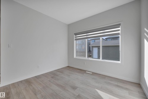Unfurnished room with baseboards and light wood-type flooring - 2275 Alces Drive, Edmonton, AB - Indoor Photo Showing Other Room