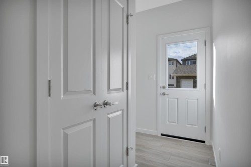 Entryway with wood finished floors and baseboards - 2275 Alces Drive, Edmonton, AB - Indoor Photo Showing Other Room